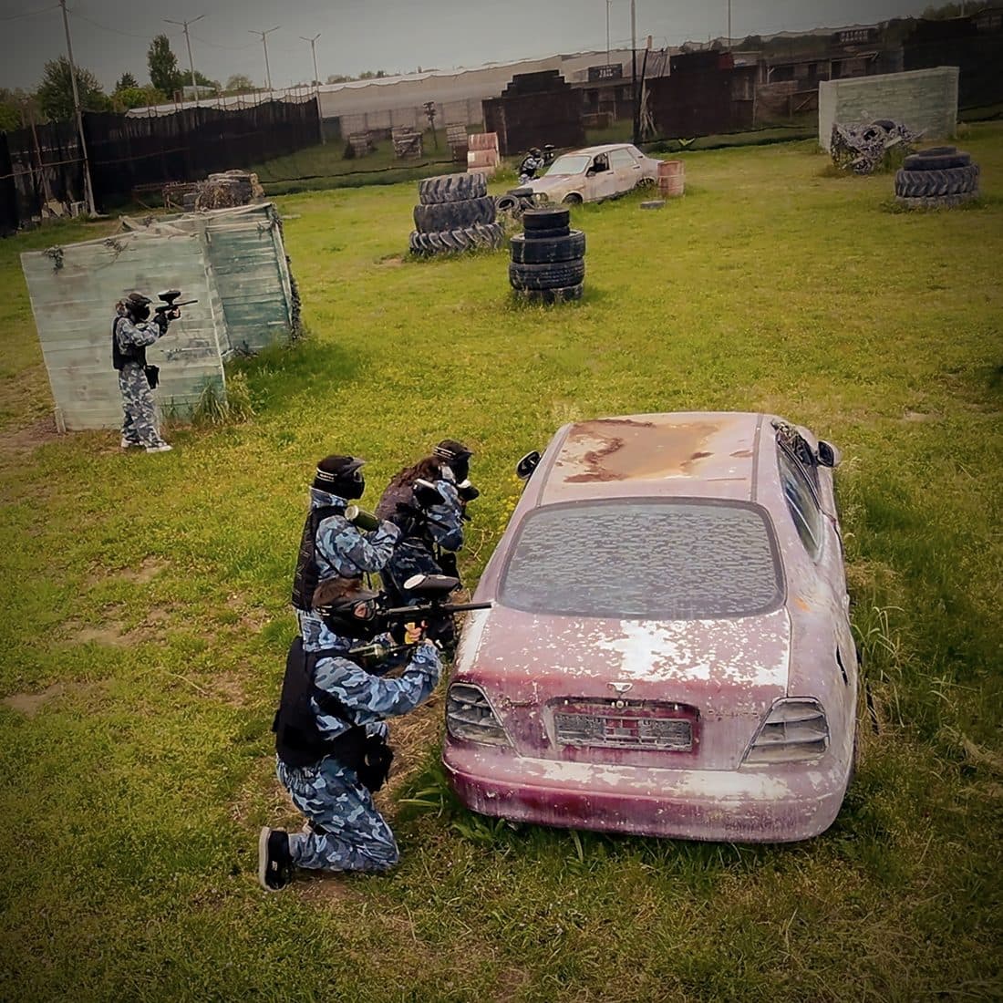 Team in action next to a wrecked car, Area 51
